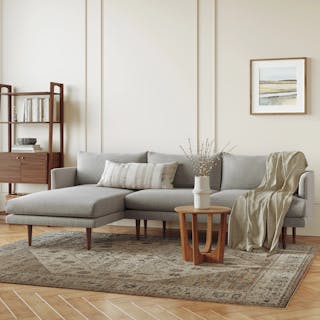 The Sophisticate Bundle, contains products [Burrard 112" Left Sectional - Seasalt Gray] and [Tovi Side Table - Smoked Oak].