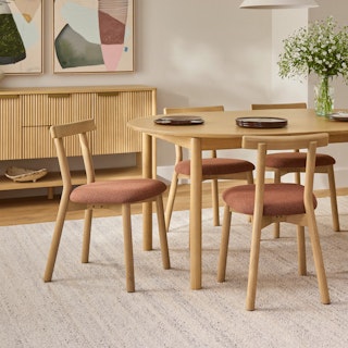 The Dine and Unwind Bundle, contains products [Heidi 48" - 67.75" Extendable Round Dining Table - White Oak] and [Ulka Dining Chair - White Oak and Ratine Oxide].
