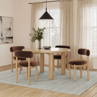 The Gourmet Gathering Bundle, contains products [Adel 55.5" Round Dining Table - White Oak] and [Munk Velvet Dining Chair - White Oak and Hale Earth].