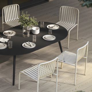 The Ballo x Sarek Dining Bundle, contains products [Ballo 78.5" Outdoor Dining Table - Black] and [Sarek Outdoor Stackable Dining Chair - Black].
