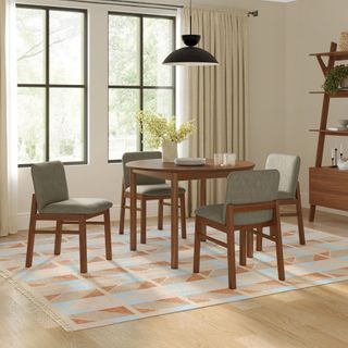 The Blissful Nook Bundle, contains products [Heidi 42" Round Dining Table - Walnut] and [Mikkel Dining Chair - Walnut and Algonquin Green].
