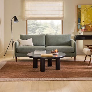 The Mid-Century Nordic Bundle, contains products [Hanson 80" Sofa - Thistle Green] and [Adel 42" Round Coffee Table - Black].