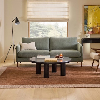 The Mid-Century Nordic Bundle, contains products [Hanson 80" Sofa - Thistle Green] and [Adel 42" Round Coffee Table - Black].