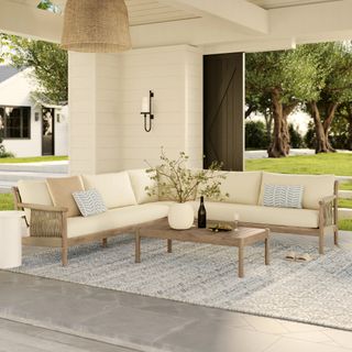 The Rosa Outdoor Sectional Set, contains products [Rosa 47" Outdoor Coffee Table - Light Eucalyptus] and [Rosa 110" Outdoor Corner Sectional - Dravite Ivory].