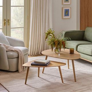 The Amoeba Coffee Table Bundle, contains products [Amoeba 42.5" Coffee Table - White Oak] and [Amoeba 29.5" Coffee Table - White Oak].