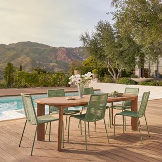 Daphne Extendable Dining Table x Zina Dining Chair Bundle, contains products [Daphne 68.5" - 91" Outdoor Extendable Dining Table - Cloud Eucalyptus] and [Zina Outdoor Stackable Dining Chair - Ochre Brown].