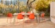 Dot Tanga Orange Stackable Dining Chair - Gallery View 2 of 11.