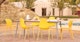 Dot Sun Yellow Stackable Dining Chair - Gallery View 2 of 11.